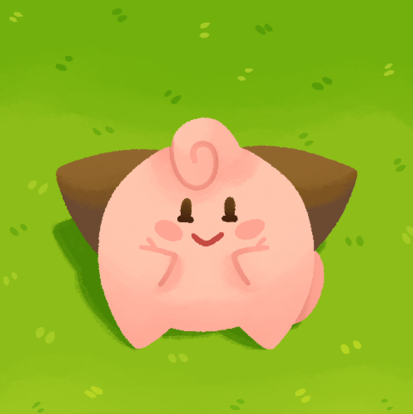 Cleffa (a pokemon) smiling up against green grass